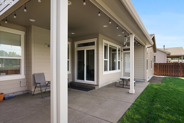 view of patio featuring fence