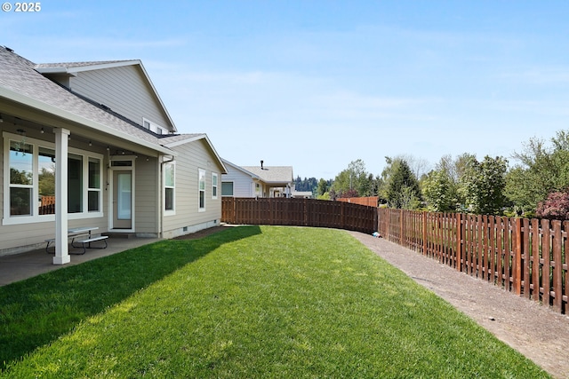 view of yard with a patio area and a fenced backyard