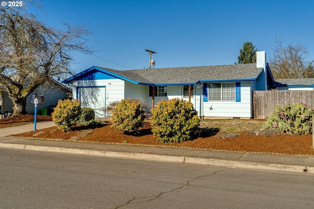 single story home featuring a garage