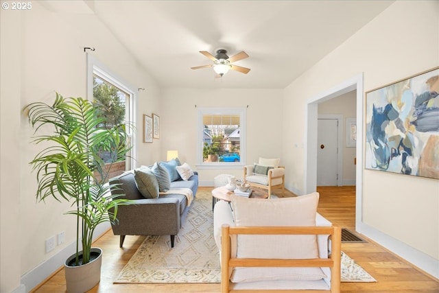 sitting room featuring ceiling fan and light wood-type flooring