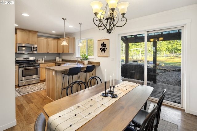 20 Silva Cutoff Rd, Lyle, WA 98635 - dining area with recessed lighting, an inviting chandelier, baseboards, ornamental molding, and wood finished floors