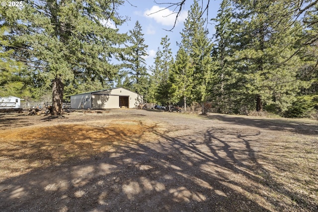 20 Silva Cutoff Rd, Lyle, WA 98635 - view of yard featuring a garage, an outdoor structure, a pole building, and driveway