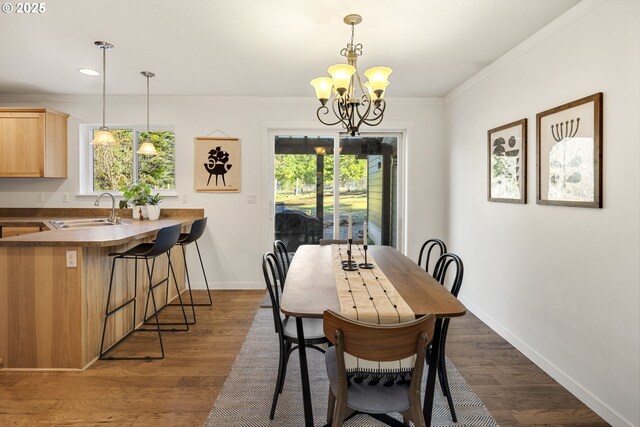 20 Silva Cutoff Rd, Lyle, WA 98635 - dining room with a chandelier, crown molding, dark wood-style floors, and baseboards