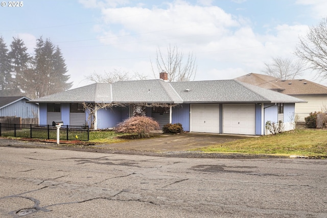 ranch-style house featuring a garage