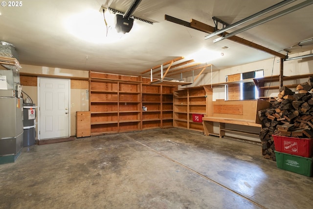 garage with a garage door opener and secured water heater