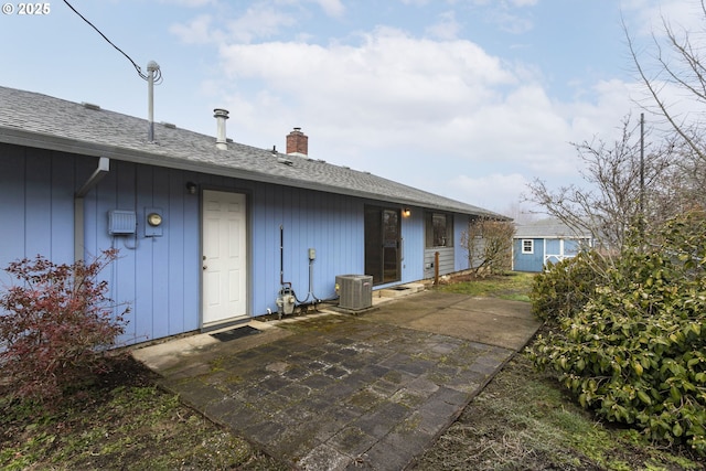 back of house featuring central AC unit and a patio