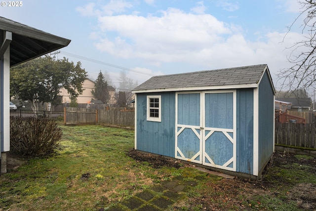 view of outbuilding featuring a lawn