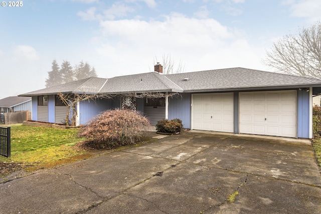 ranch-style house with a garage and a front yard