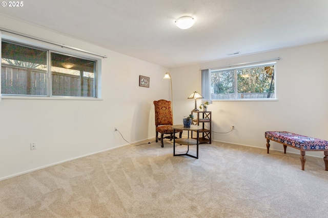 sitting room featuring carpet, visible vents, and baseboards