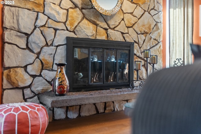 details featuring wood finished floors and a fireplace