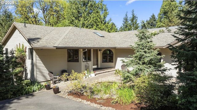 18805 Parkwood Pl, West Linn, OR 97068 - view of exterior entry featuring french doors and a shingled roof