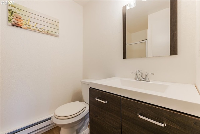 18203 S Windy City Rd, Mulino, OR 97042 - bathroom featuring a baseboard radiator, vanity, and toilet