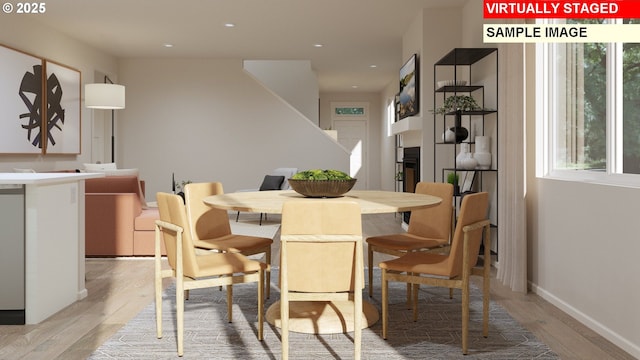 dining area with recessed lighting, light wood-type flooring, and baseboards