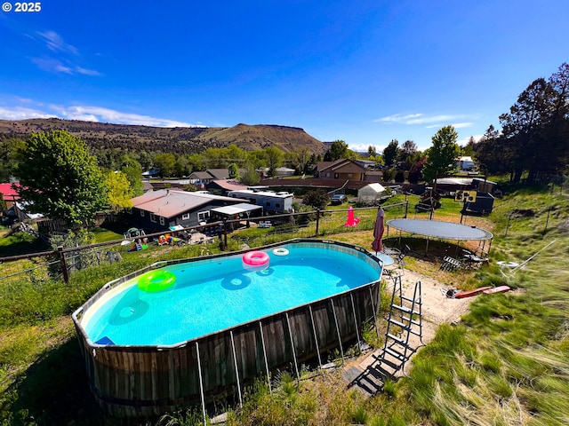 858 E Main St, John Day, OR 97845 - view of swimming pool featuring a mountain view
