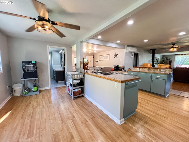 858 E Main St, John Day, OR 97845 - kitchen featuring ceiling fan, a peninsula, a sink, light wood-type flooring, and recessed lighting