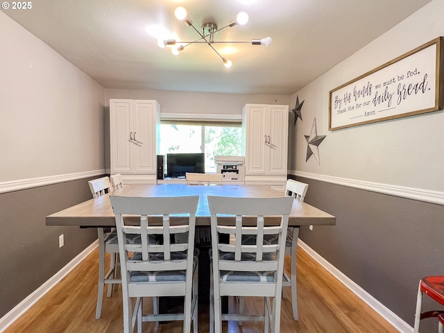 858 E Main St, John Day, OR 97845 - dining room with light wood finished floors, a chandelier, and baseboards