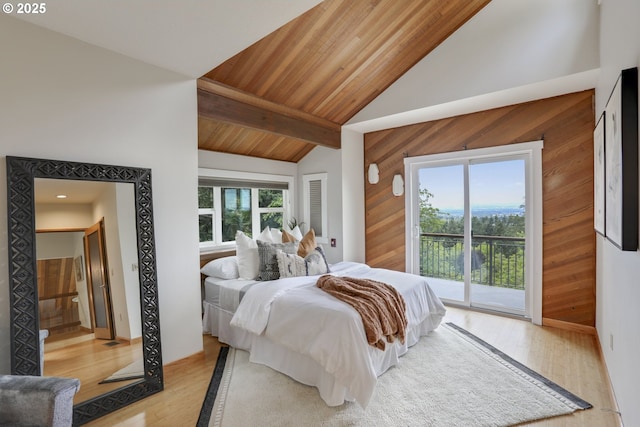 175 SW 85th Ave, Portland, OR 97225 - bedroom with access to exterior, wooden walls, multiple windows, wood finished floors, and a wooden ceiling with exposed beams