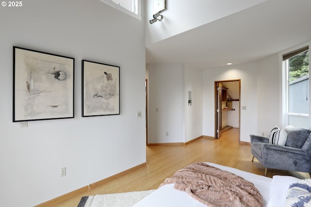 175 SW 85th Ave, Portland, OR 97225 - bedroom with light wood finished floors and a walk in closet