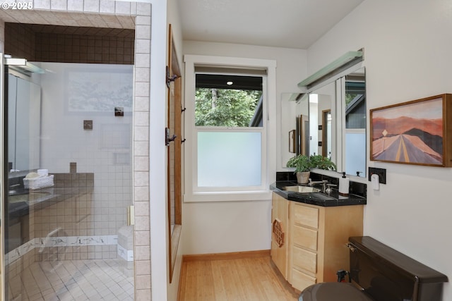 175 SW 85th Ave, Portland, OR 97225 - bathroom with a tile shower, vanity, wood finished floors, and a tub to relax in