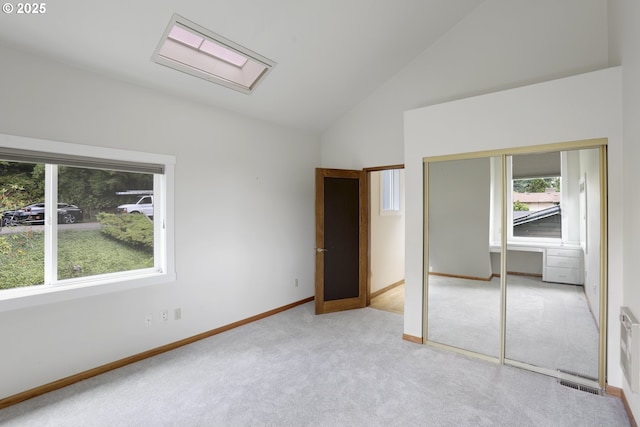 175 SW 85th Ave, Portland, OR 97225 - unfurnished bedroom featuring carpet floors, a closet, high vaulted ceiling, and a skylight