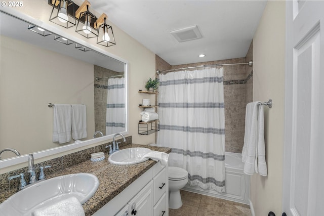 full bathroom with a sink, toilet, tile patterned floors, and shower / bath combination with curtain