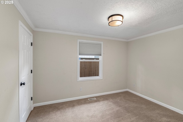 spare room with baseboards, visible vents, a textured ceiling, and carpet