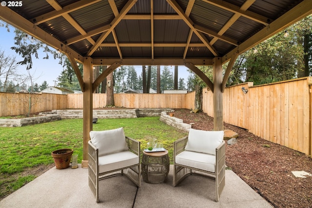 view of patio with a gazebo and a fenced backyard