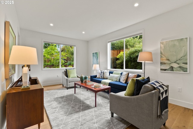 927 SW Maplecrest Ct, Portland, OR 97219 - living area with healthy amount of natural light, recessed lighting, baseboards, and light wood finished floors