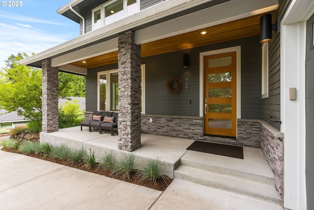 927 SW Maplecrest Ct, Portland, OR 97219 - property entrance with a porch and stone siding