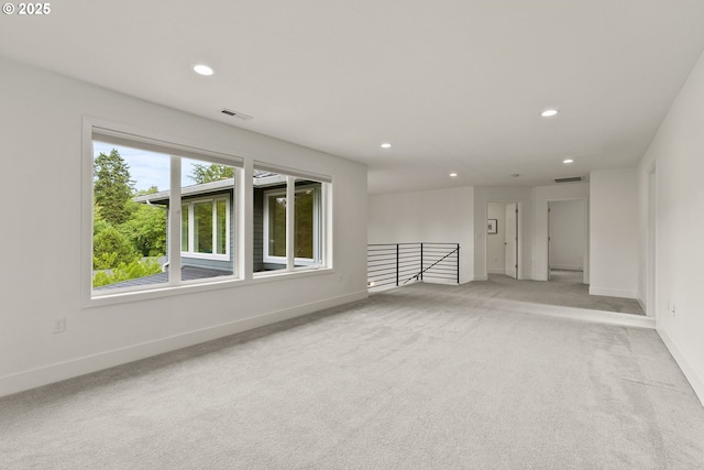 927 SW Maplecrest Ct, Portland, OR 97219 - unfurnished room featuring recessed lighting, light carpet, and baseboards