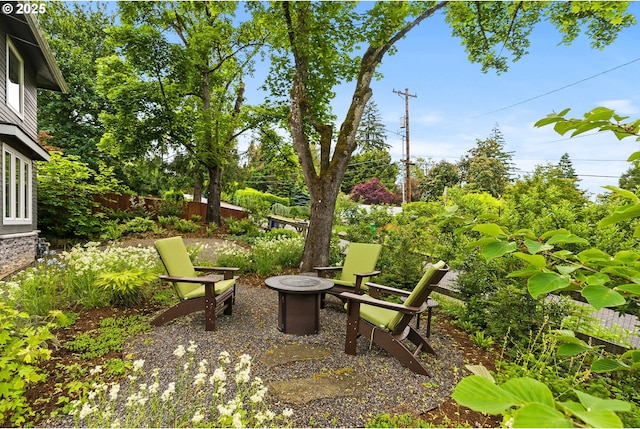 927 SW Maplecrest Ct, Portland, OR 97219 - view of patio with an outdoor fire pit