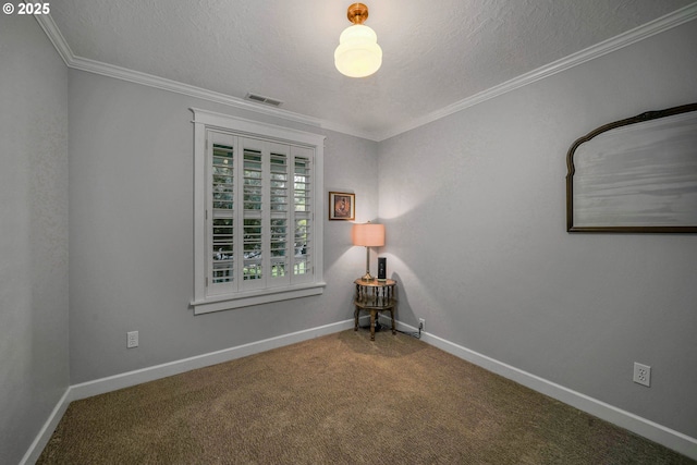 carpeted empty room featuring ornamental molding, a textured ceiling, and baseboards