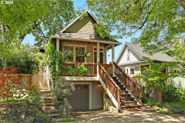 9115 N Richmond Ave, Portland, OR 97203 - back of house with a porch, a garage, fence, stairway, and concrete driveway