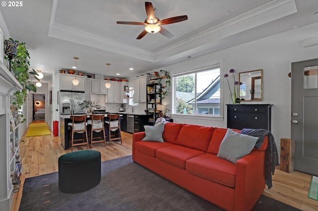 9115 N Richmond Ave, Portland, OR 97203 - living room with a raised ceiling, light wood-type flooring, a ceiling fan, crown molding, and recessed lighting