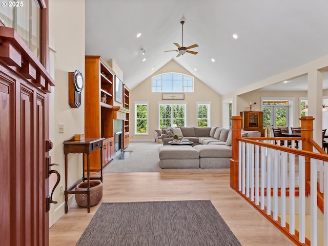 21800 S Green Mountain Rd, Colton, OR 97017 - living area featuring ceiling fan, high vaulted ceiling, light wood-style floors, recessed lighting, and a glass covered fireplace