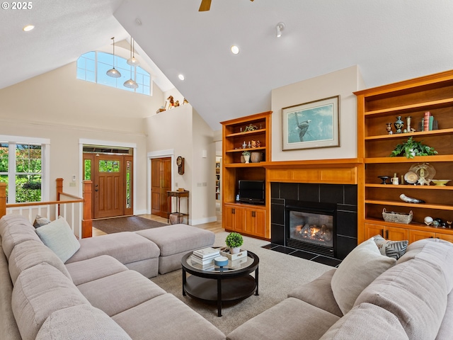 21800 S Green Mountain Rd, Colton, OR 97017 - living area featuring a fireplace, high vaulted ceiling, ceiling fan, recessed lighting, and built in shelves