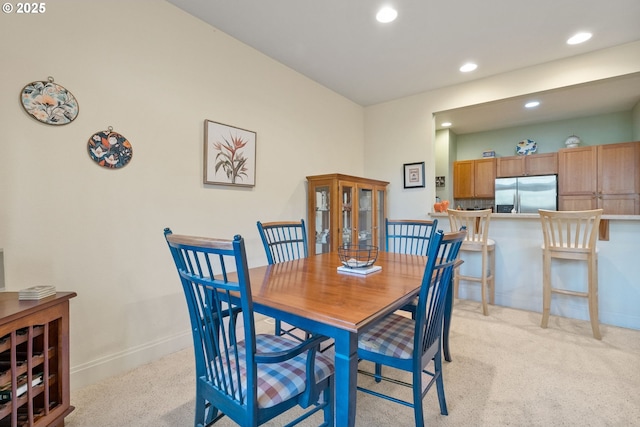 view of carpeted dining space