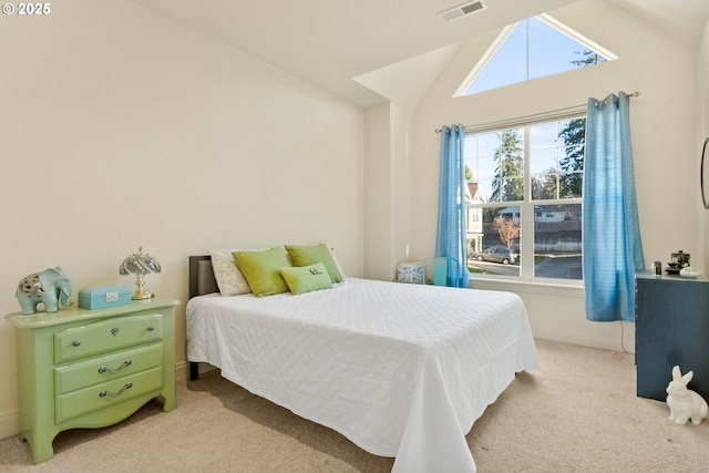 bedroom featuring lofted ceiling and light carpet