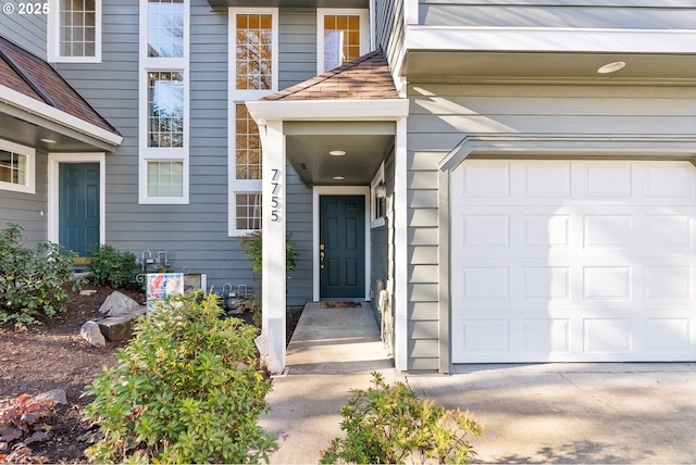 doorway to property featuring a garage