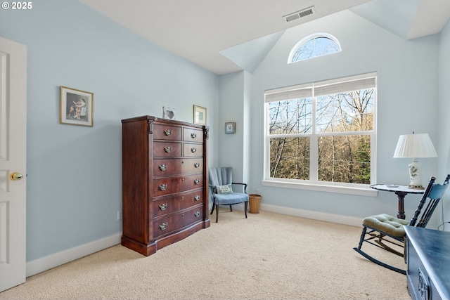 living area with vaulted ceiling and light carpet