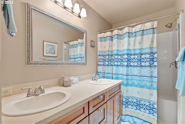 bathroom with vanity and curtained shower