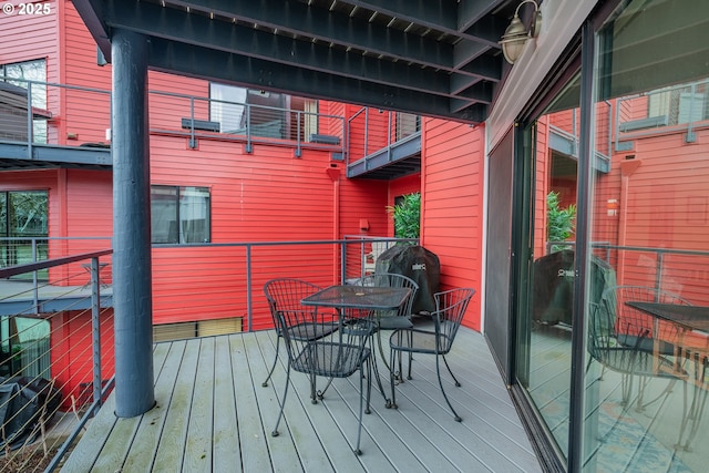 606 NW Naito Pkwy Unit A14, Portland, OR 97209 - wooden terrace featuring outdoor dining area and area for grilling