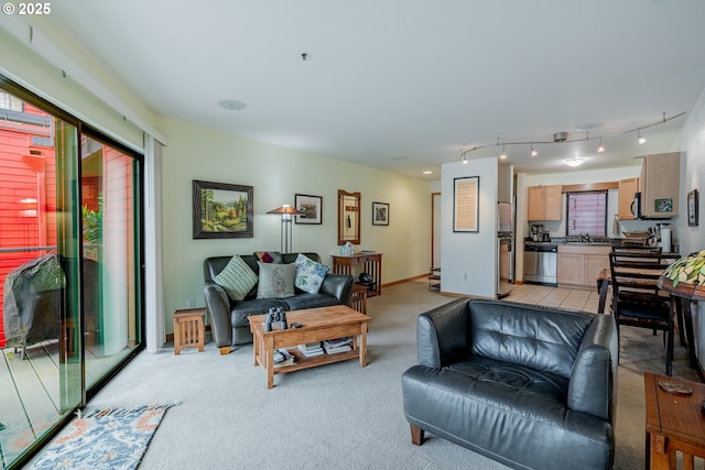 606 NW Naito Pkwy Unit A14, Portland, OR 97209 - living room with light colored carpet and rail lighting