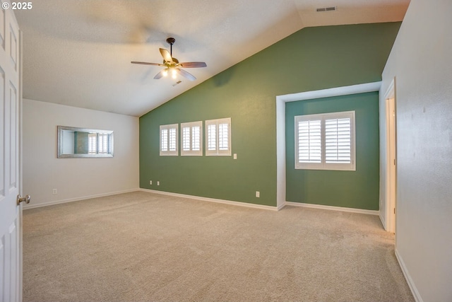 2301 NW 15th St, Battle Ground, WA 98604 - carpeted spare room with a wealth of natural light, ceiling fan, visible vents, and lofted ceiling