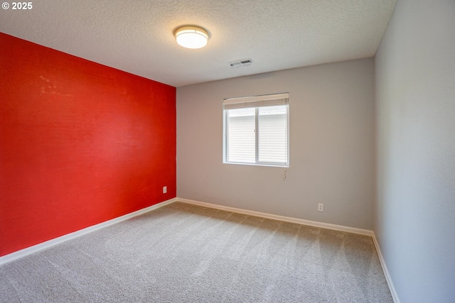 2301 NW 15th St, Battle Ground, WA 98604 - spare room featuring a textured ceiling, baseboards, visible vents, and carpet floors