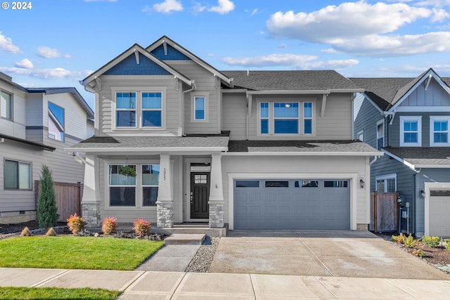 craftsman inspired home with a front yard and a garage