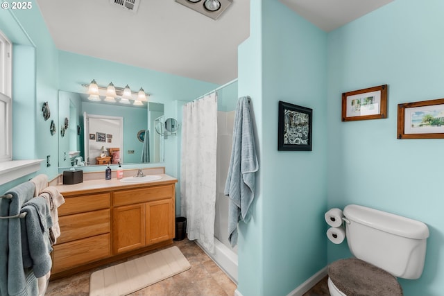 bathroom featuring a stall shower, visible vents, vanity, and toilet