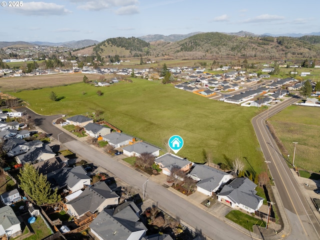 drone / aerial view with a residential view and a mountain view