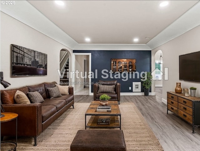 802 NW 5th Cir, Camas, WA 98607 - living area featuring arched walkways, wood finished floors, baseboards, and recessed lighting