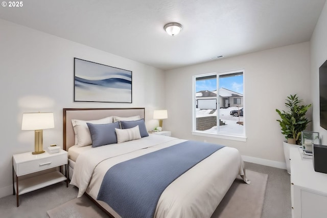 bedroom featuring light colored carpet